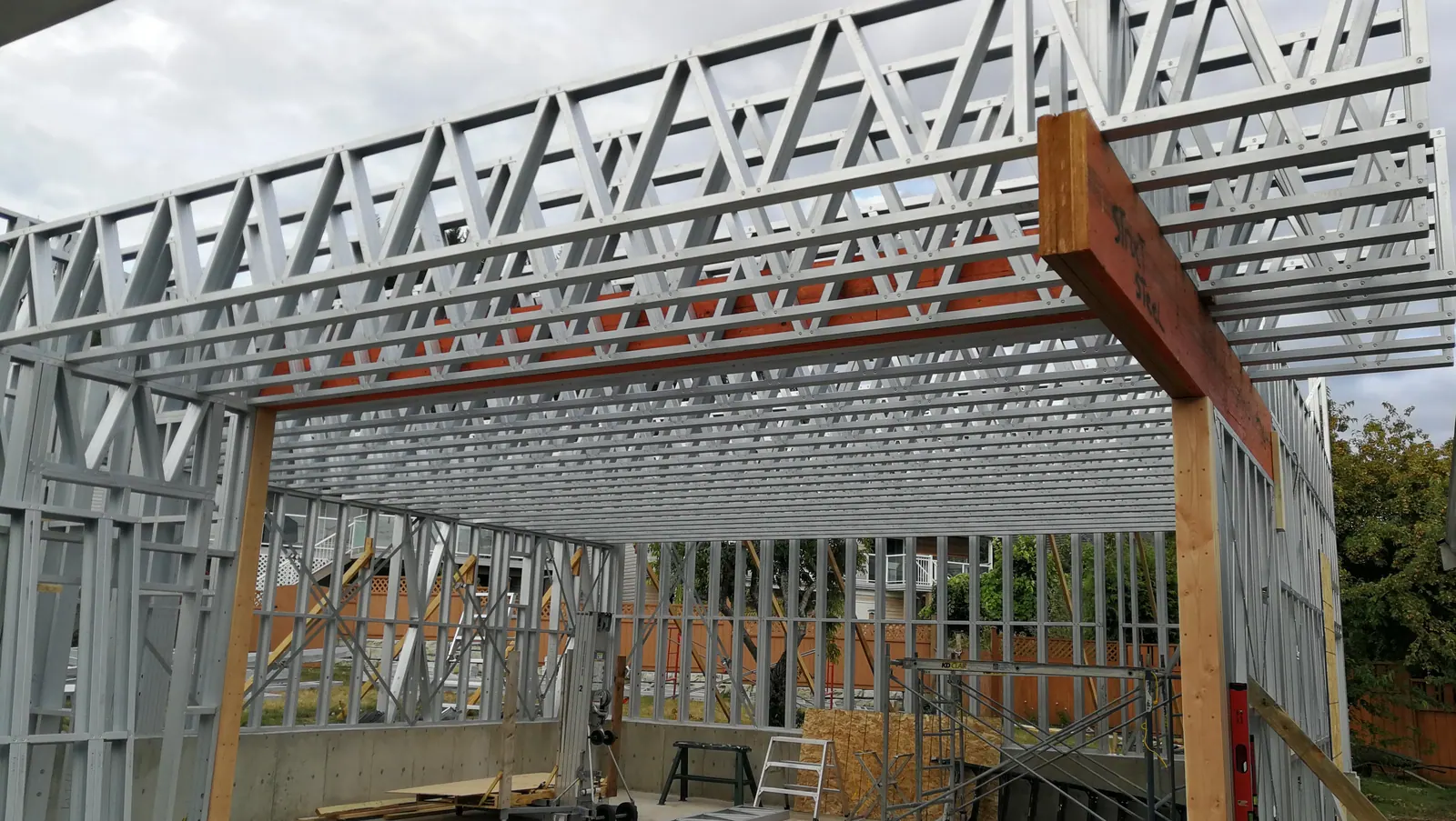 Steel-framed walls and trusses being erected on a commercial project