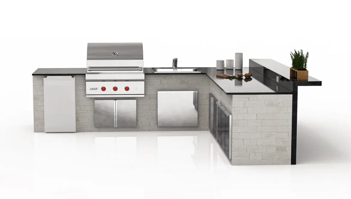 Finished L-shaped outdoor kitchen with built-in grill, sink and bar counter