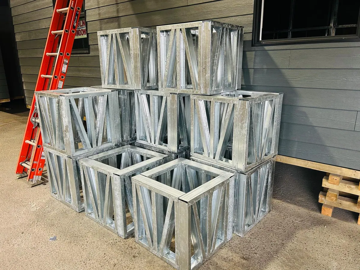 Stacked galvanized steel blocking assemblies